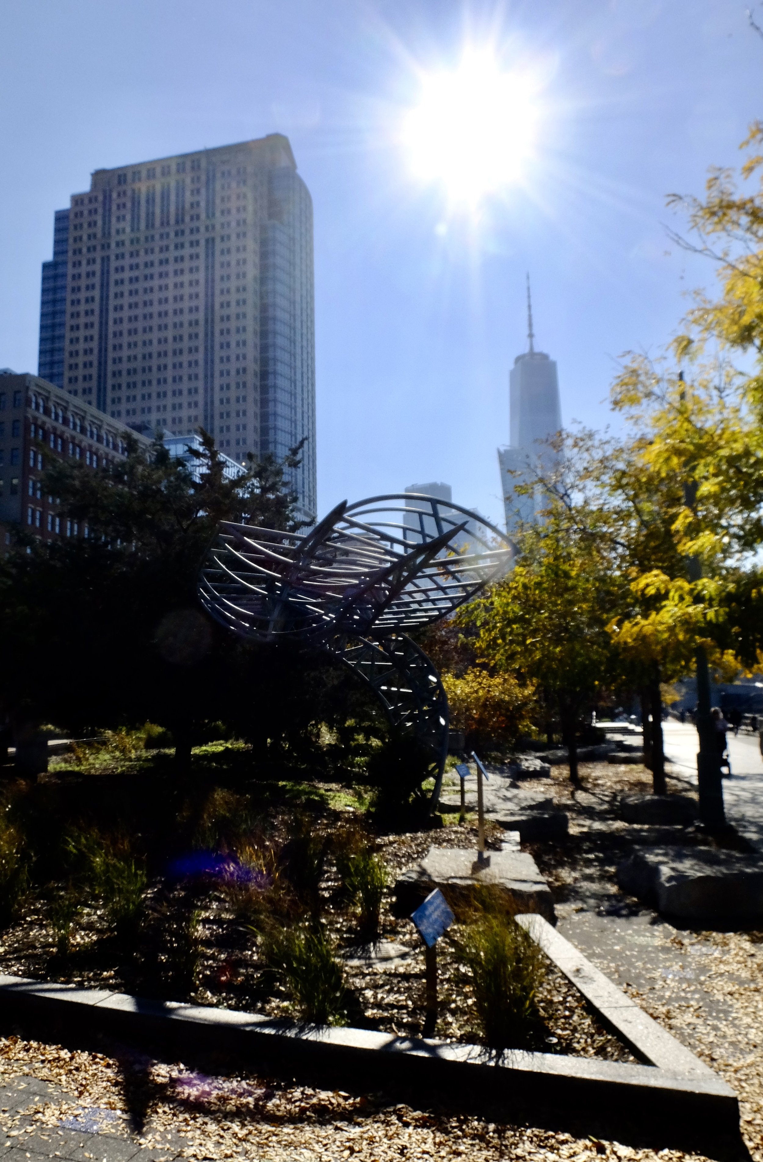  "Serpentine Structures  by  Marc Gibian along the esplanade... curved industrial trusses built of steel pipe that has been rolled, notched, &amp; welded."  We had just seen his work on the East River's Northside Piers. 