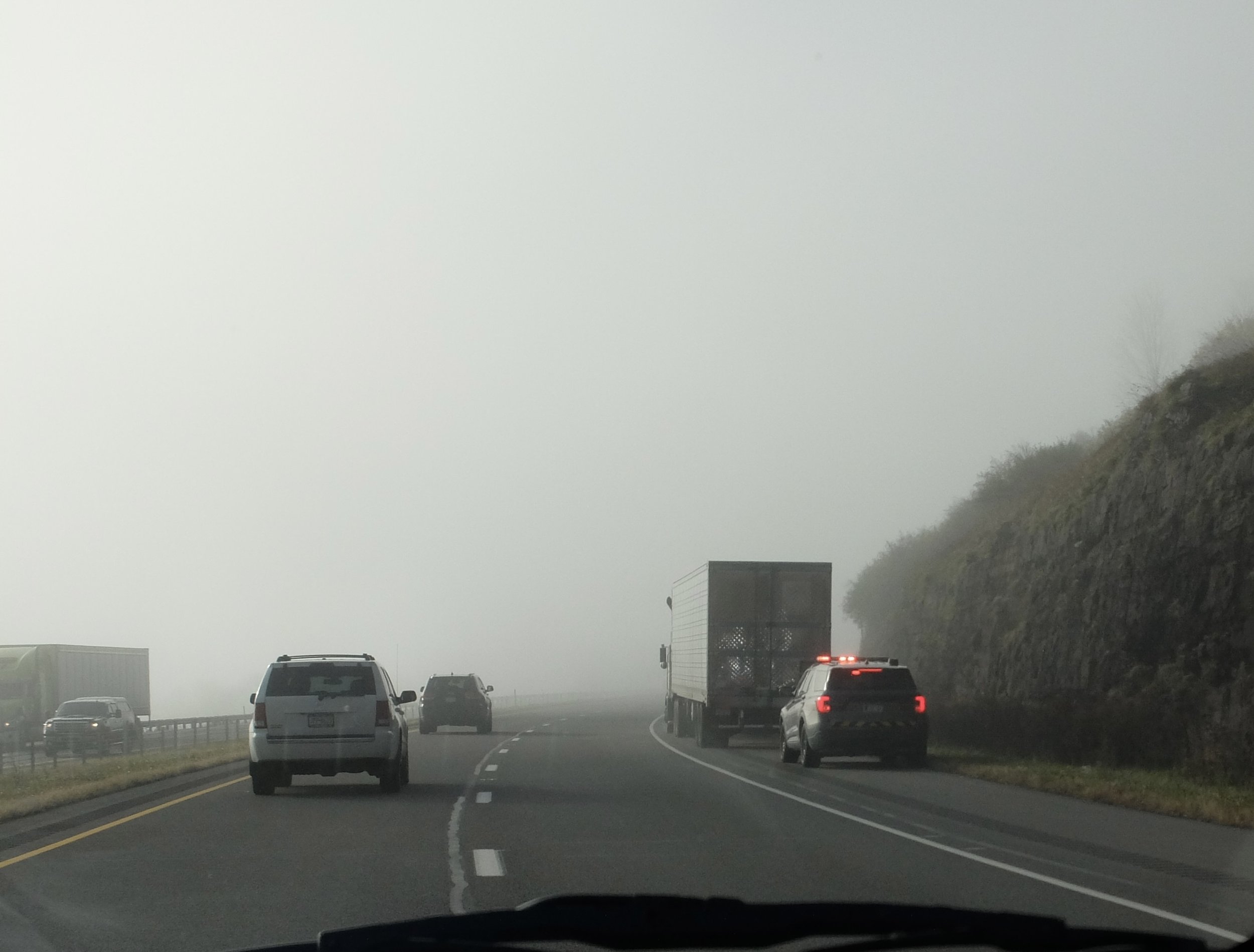 Gotcha!  We guessed the truck was pulled over for not having lights on in this heavy fog.