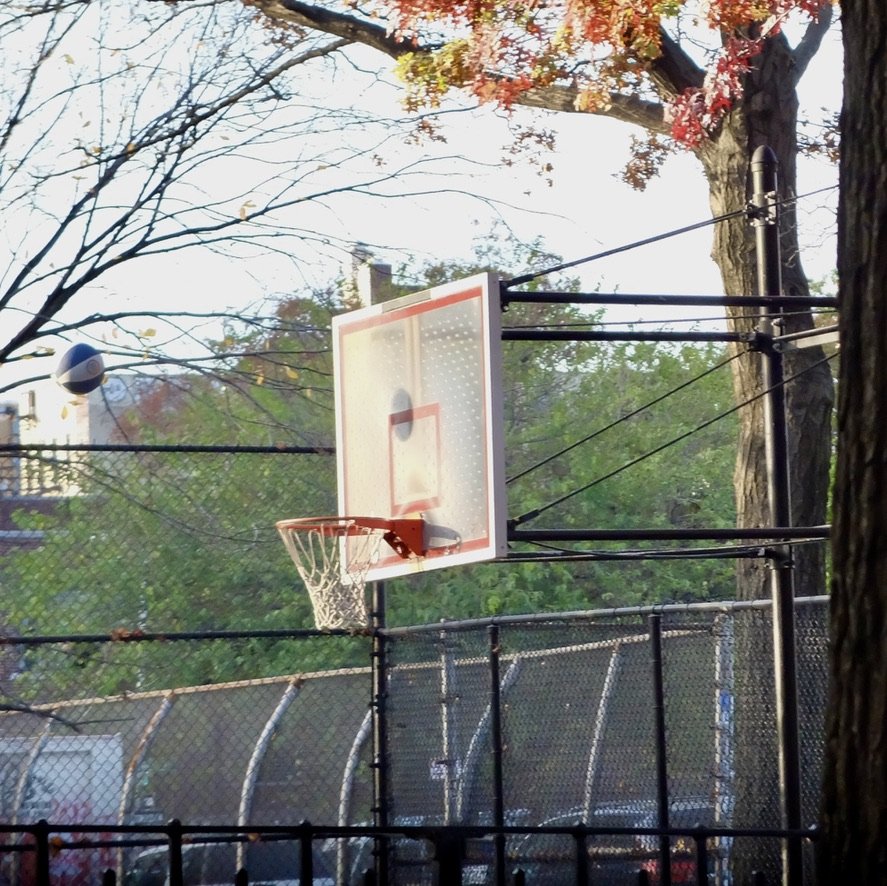 As the neighborhood transitioned, basketball was being played.