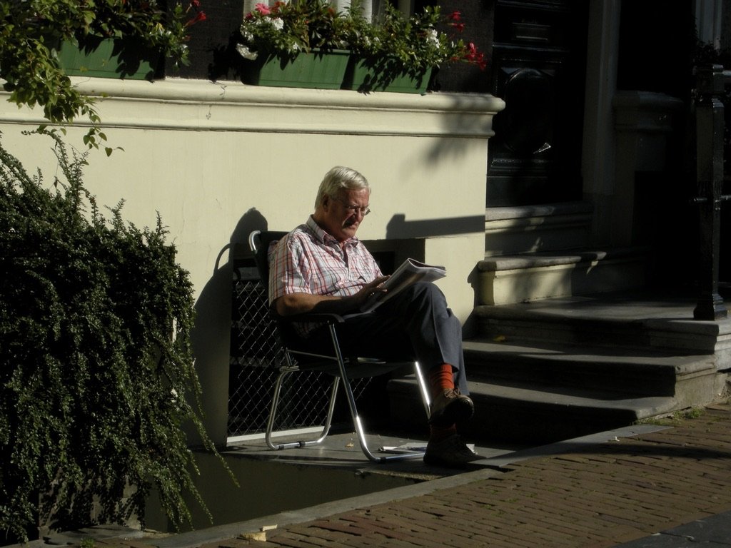  Sometimes the subject was totally engrossed in something, unaware of me &amp; I had time to compose &amp; take the exposure.   Amsterdam, Netherlands. 