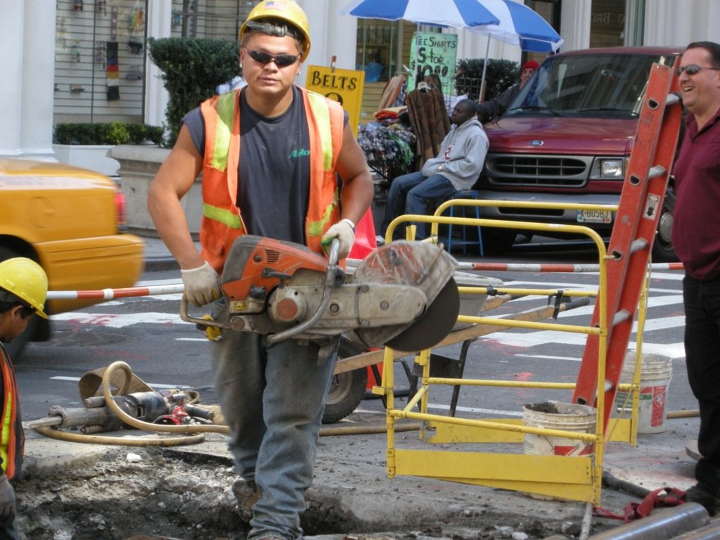  Let 'er rip.  He had just fired up that machine to cut some metal pipes.  Lots of sparks followed.  Manhattan, NY. 