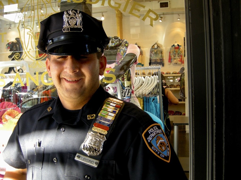  Times Sq., NY.  Here's a proud cop.  One ribbon was for being at the WTC on 9/11 but he  couldn't remember what some of the others were for! 