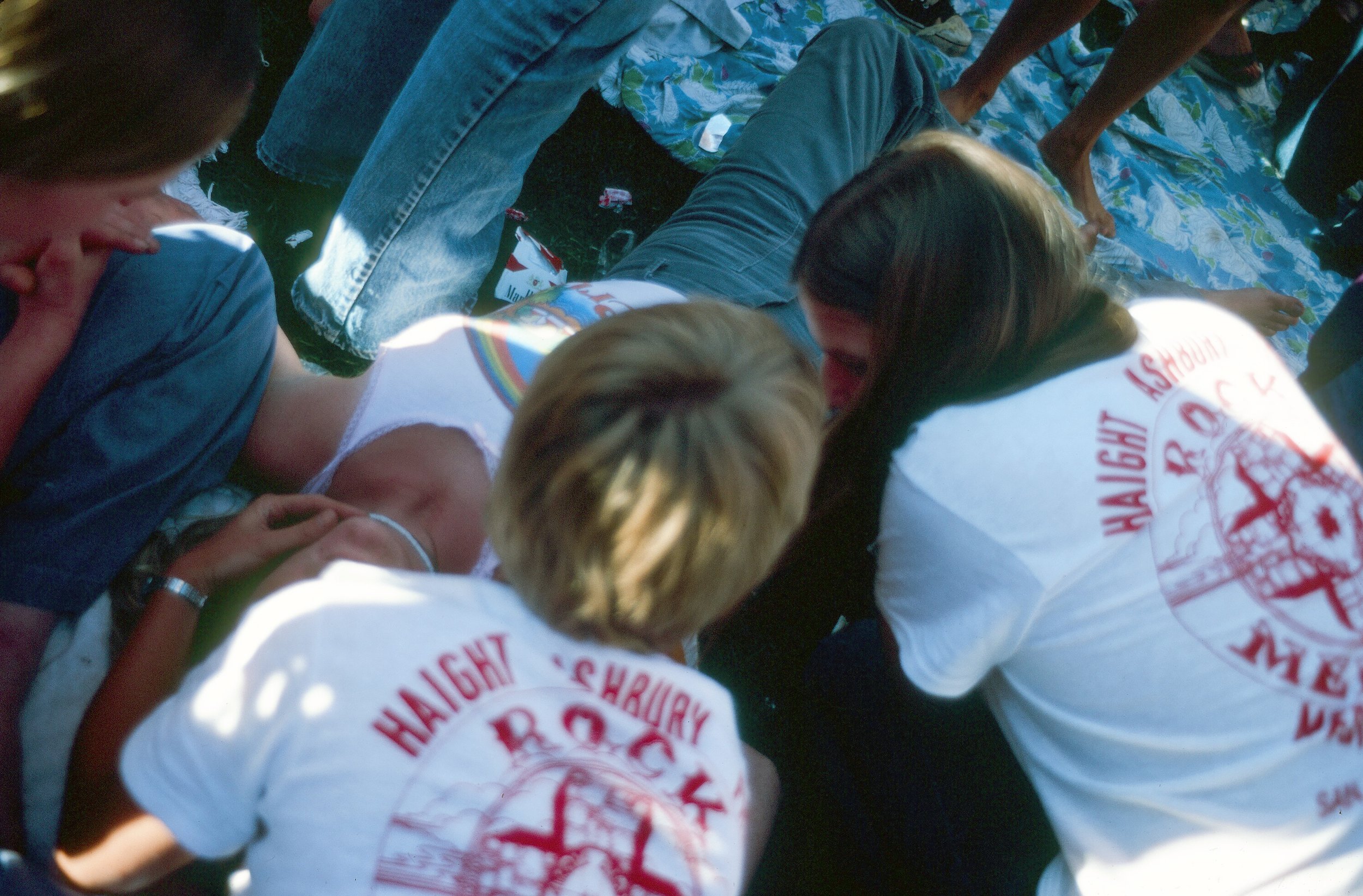  Oakland Coliseum, Oakland, CA.  Day on the Green Concert.  Haight Ashbury Free Medical Clinic Bill Graham Rock Medicine volunteers dealing with a gal who had too much wine, heat &amp; not enough water.  