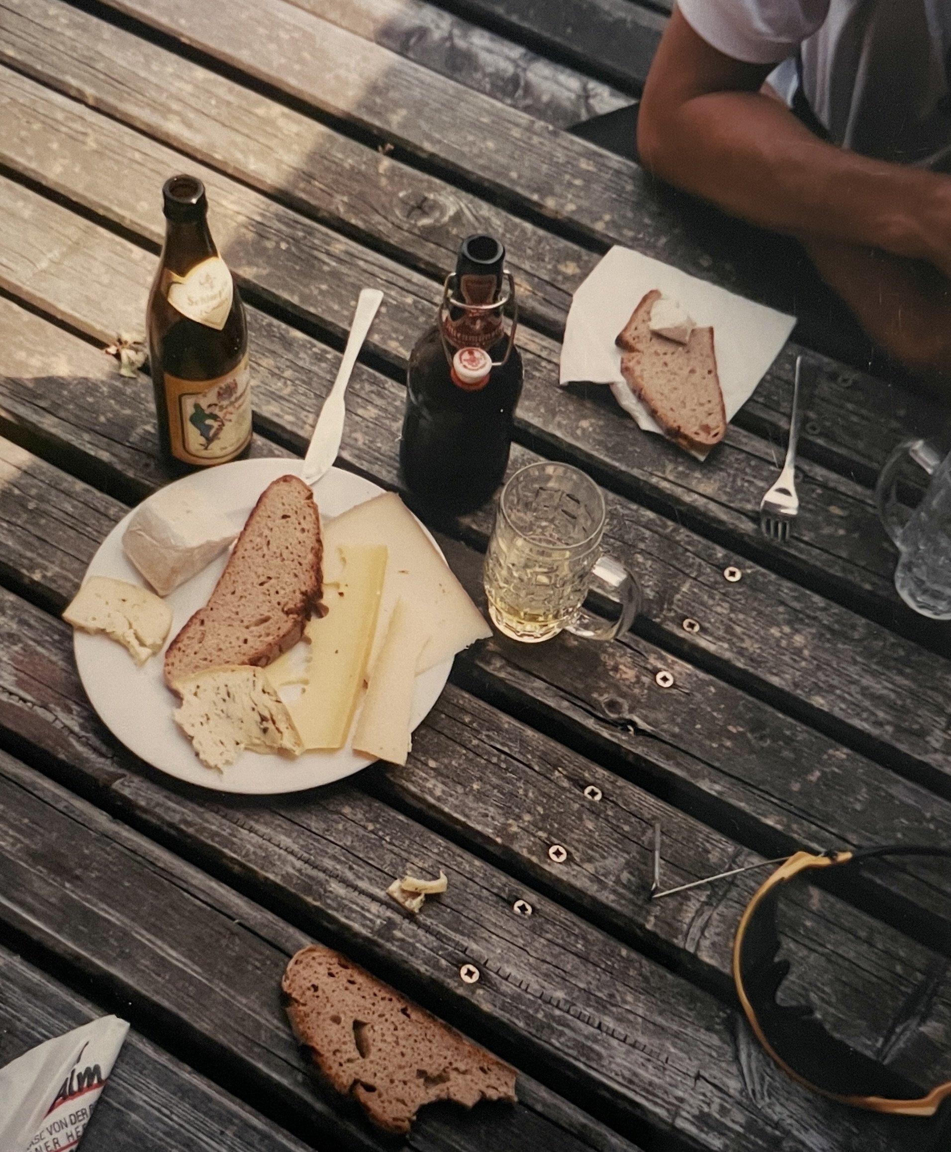  Somewhere in the farmland of Bavaria, Germany.  We were hungry,  miles from nowhere &amp; came upon a building that said “Käse.”  We knew that meant cheese.  We had a radler style beers &amp; sustenance… 