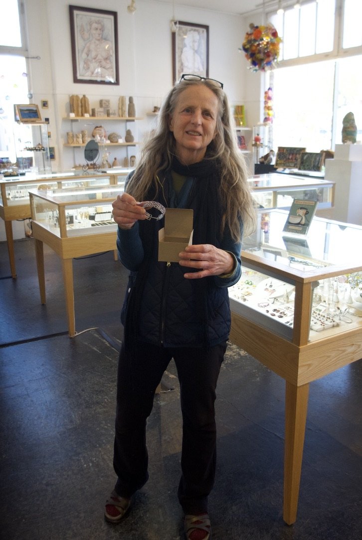    acci Cooperative Gallery.  Irene Storch - Jewelry-making.   The bracelet she’s holding is for Naomi.  "Equally inspired by the designs &amp; materials of modern technology as those of nature &amp;…  