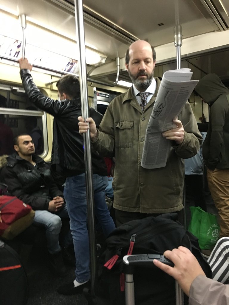My dad commuted to work in Manhattan, a.k.a. "The CIty".  He taught me how to fold the Herald Trbune to read while standing on the train.