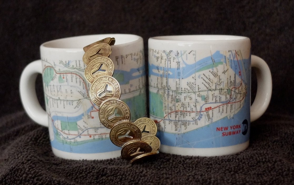  When I was growing up in NYC, the turnstyle fare was a token. My dad always had a bunch of tokens jangling in his pockets.  This bracelet &amp; espresso cups came from the shop in the NY Transit Museum's Grand Central Station location. 