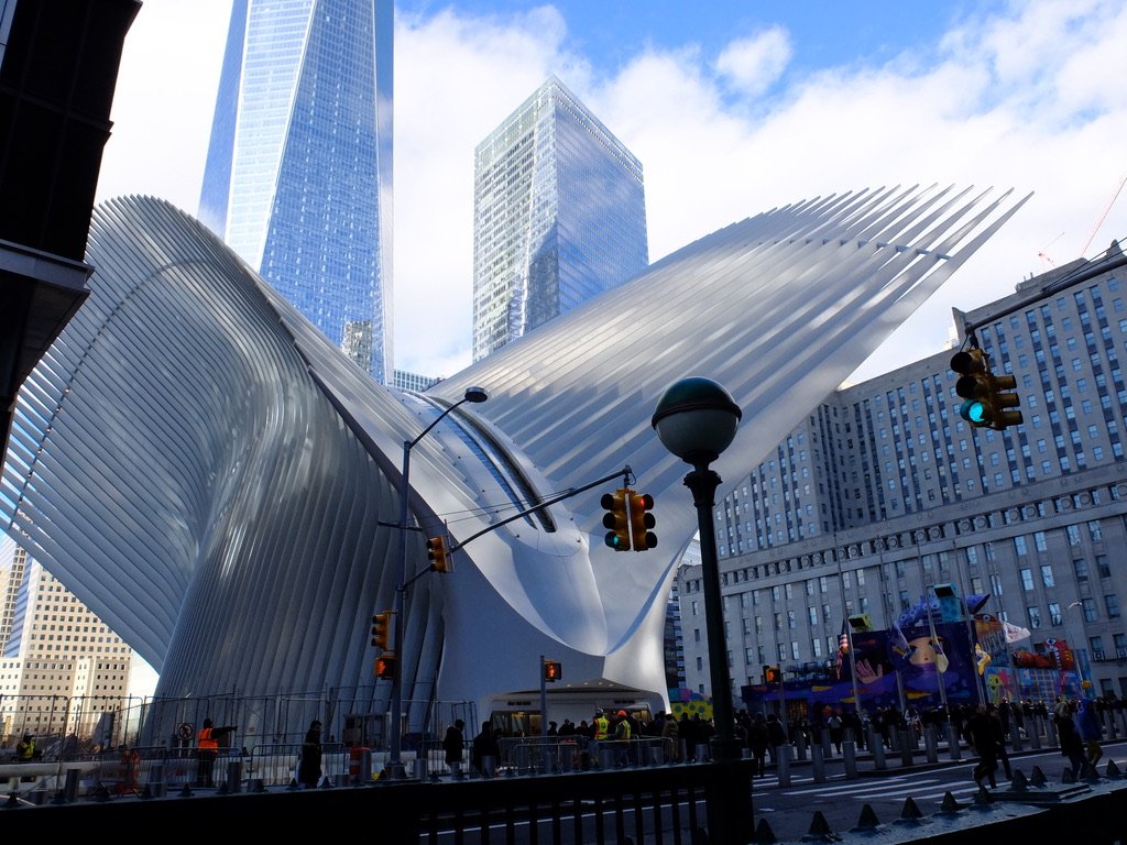  The Santiago Calatrava designed  Oculus Transportation Hub - World Trade Center  “is home to 12 subway lines, the World Trade Center PATH  station , and dozens of retailers, serving over a million people every week.” 