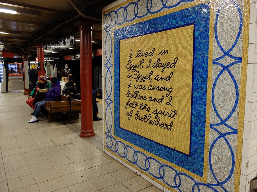  Back to back seating can be uncomfortable in the time of COVID.  110 St. Central Park North - Maren Hassinger -  Message from Malcom  1998 Glass mosaic. 