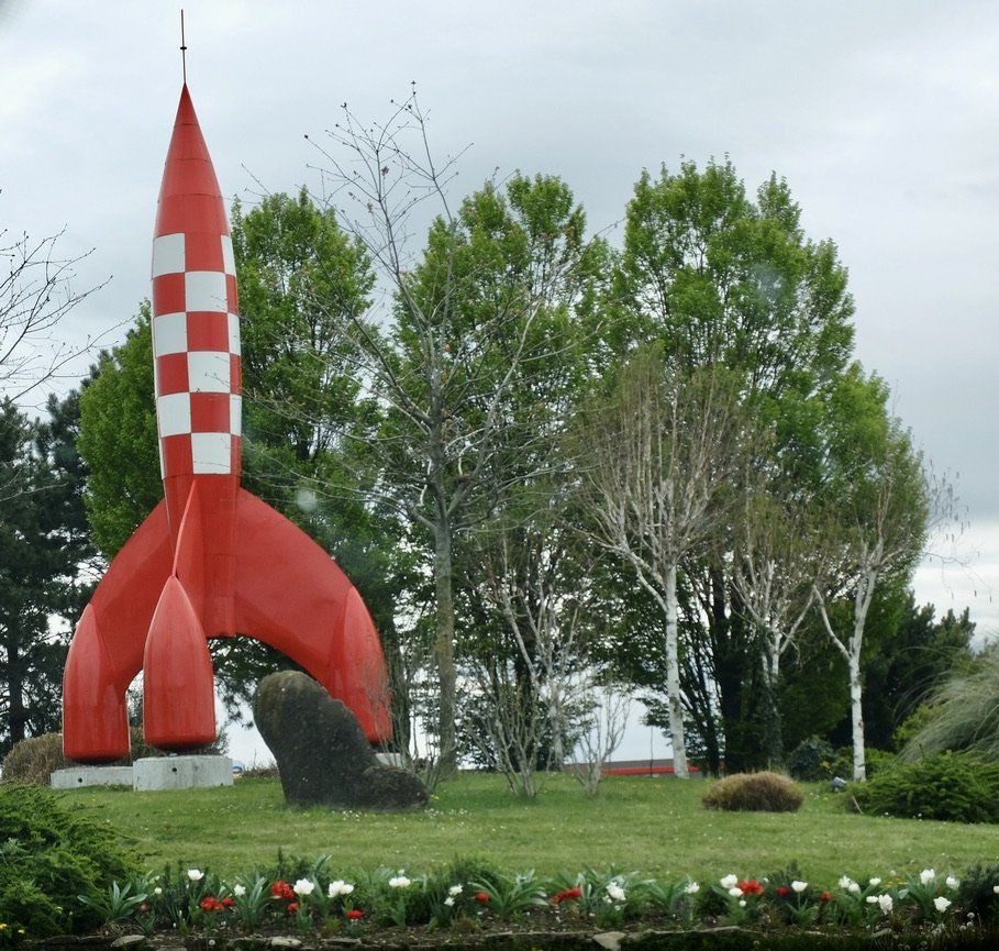  Most roundabouts in the Vallée De La Drôme have some decoration.  In this case, Tin Tin’s rocket ship. This roundabout appeared two times in past versions of the Tour de France. 