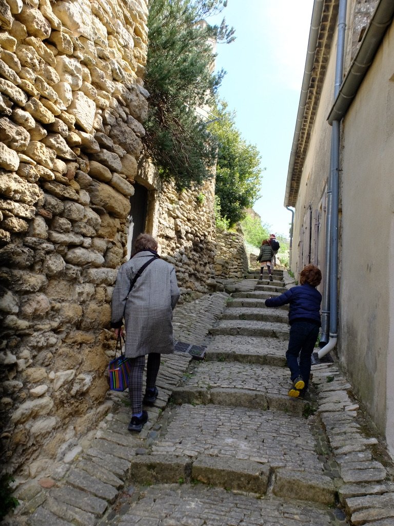 Climbing the steps to the Château de Grignen.