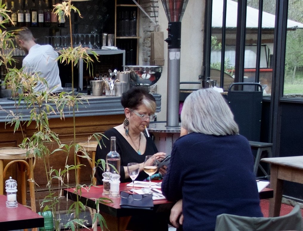  Saoû - La Fontaine Minerale Restaurant -woman with dangling cigarette.  She soon went outside to light up. 