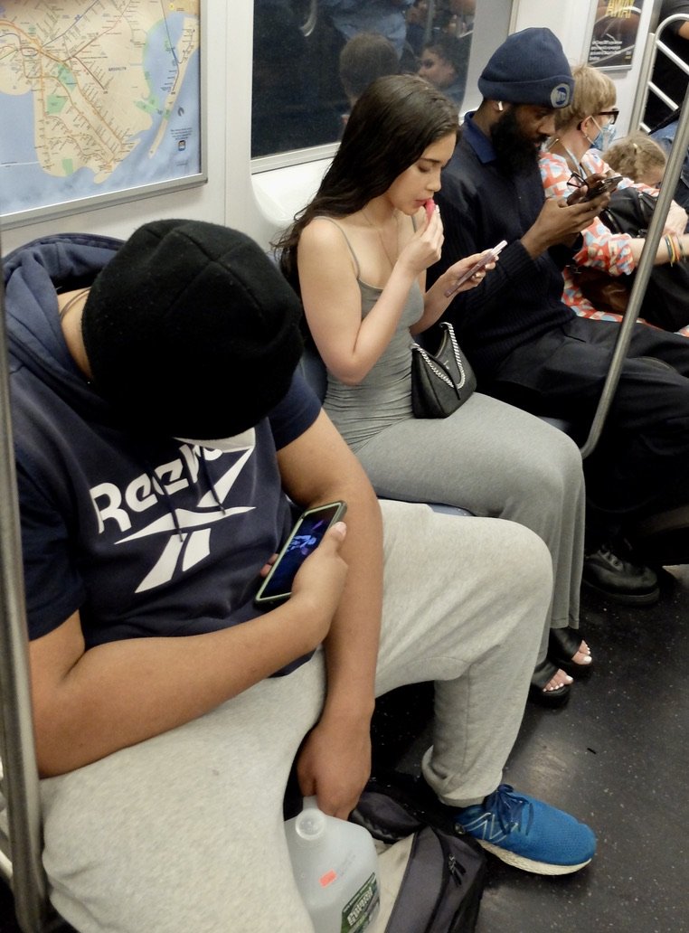 Manspread &amp; the art of applying lipstick while riding in a speeding express train subway car.
