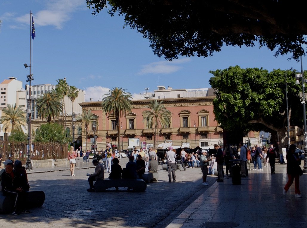  Piazza Verdi with the opera house on the left.  The palazzo ahead, once marked the outskirts of Palermo.  Prior to the era of Mayor Orlando, children were told not cross over to this side as they could get robbed or knifed.  For more detailed info. 