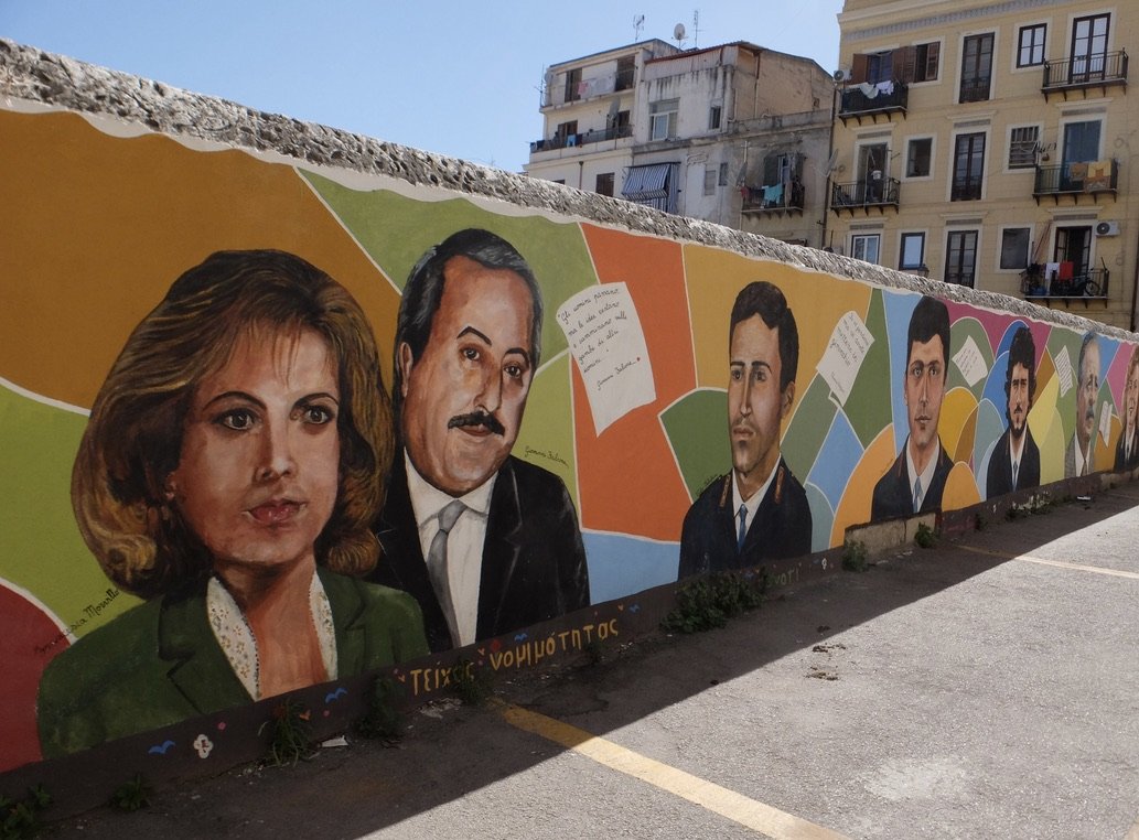  An over block long mural depicting people murdered by the mafia.   