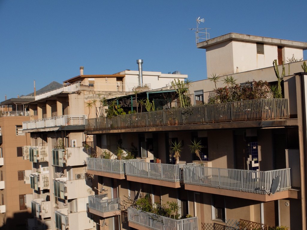  From the Hotel Opera Plaza - Osservatorio  Rooftop.  Note the light tan second building falling apart because of substandard materials.   