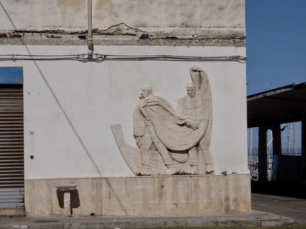  An abandoned building with a Fascist era relief sculpture. 