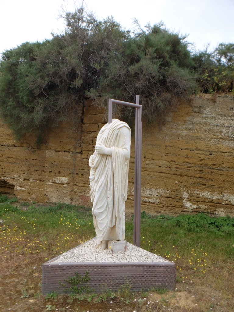  When a new Roman executive arrived, the locals just changed the head.   There were a bunch of these headless statues around. 