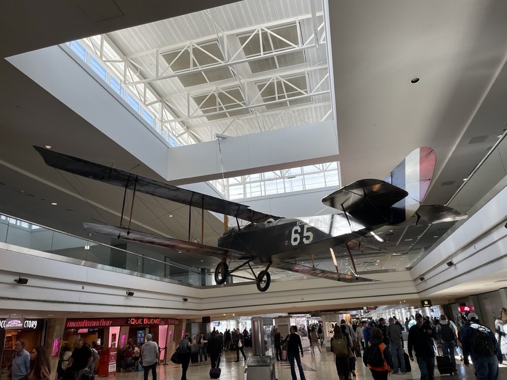  We flew United with a stopover in Denver.  But not in this 1918 CURTISS JENNY JN-4D Standard W.W. I Pilot Trainer that’s hanging in the Denver airport. 