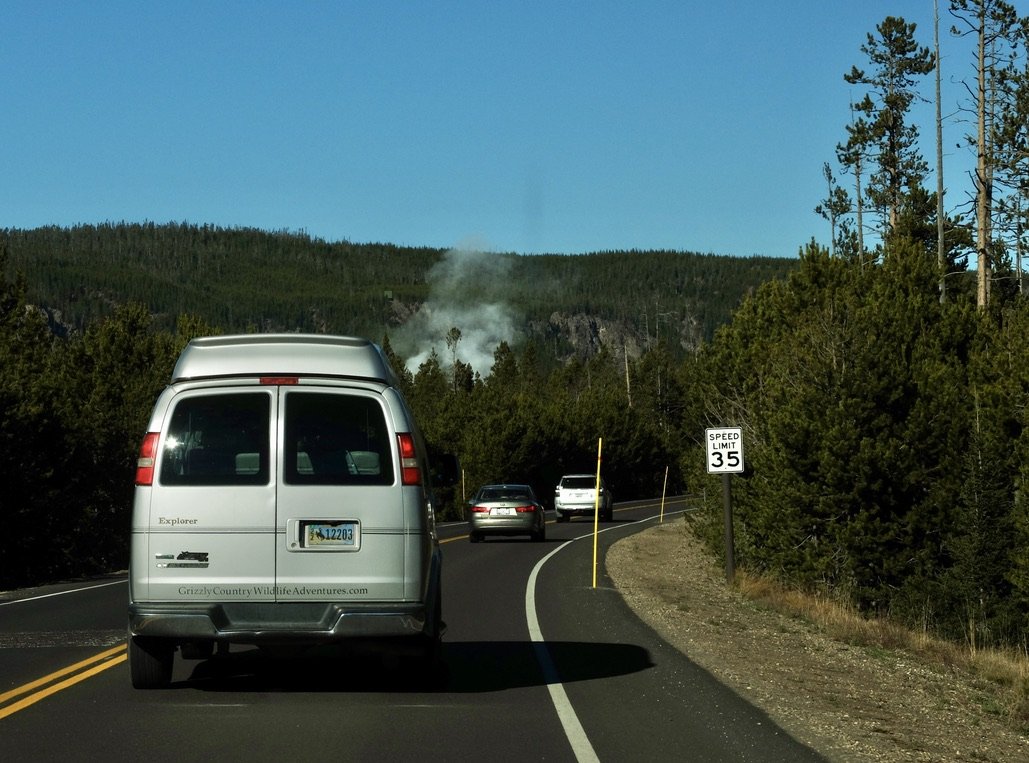  We were about two hours into our drive from Jackson &amp; well into Yellowstone National Park. We noted that white plume up ahead.  Coming from Marin County, we immediately thought “controlled burn.”  I looked at the map &amp; noted we were approach