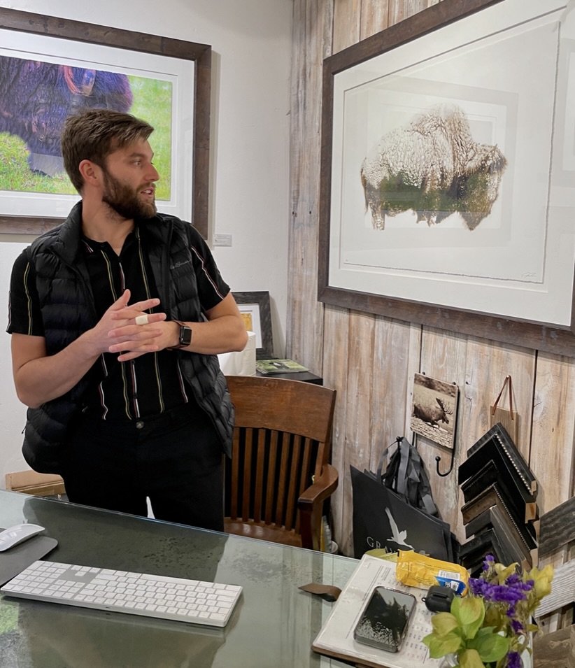  GARY CRANDALL's gallery in Jackson - Gabe from Roumania with 2 masters degress in geology describing Gary’s work.  Gabe was anxiously awaiting his second winter in Jackson having survived his first here when the temperature dove to 40 below. 