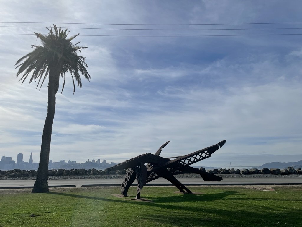 Treasure Island.  It's recently been made accesible for bicycles.  The caveat is that there is a 16% grade to get back up to the Bay Bridge.  Not a problem on my e bike!