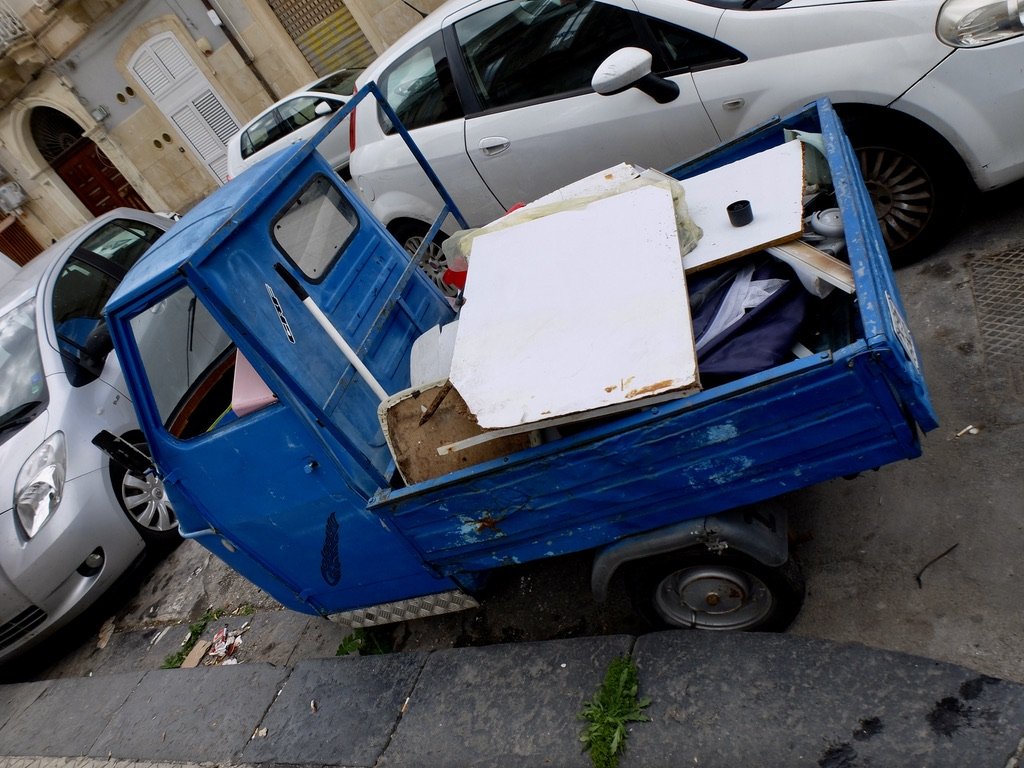  APE (Ah-pey) Piaggio truck.  Ape = bee.  The truck sounds like a bee. 