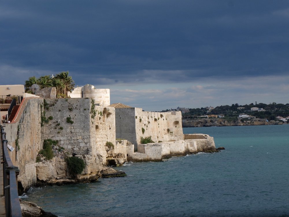  Castello Maniace on the tip of the Island of Ortigia.  “The Maniace Castle, which is a stronghold built by the Swabians during their rule of Sicily, and a world heritage site since 2005.” 