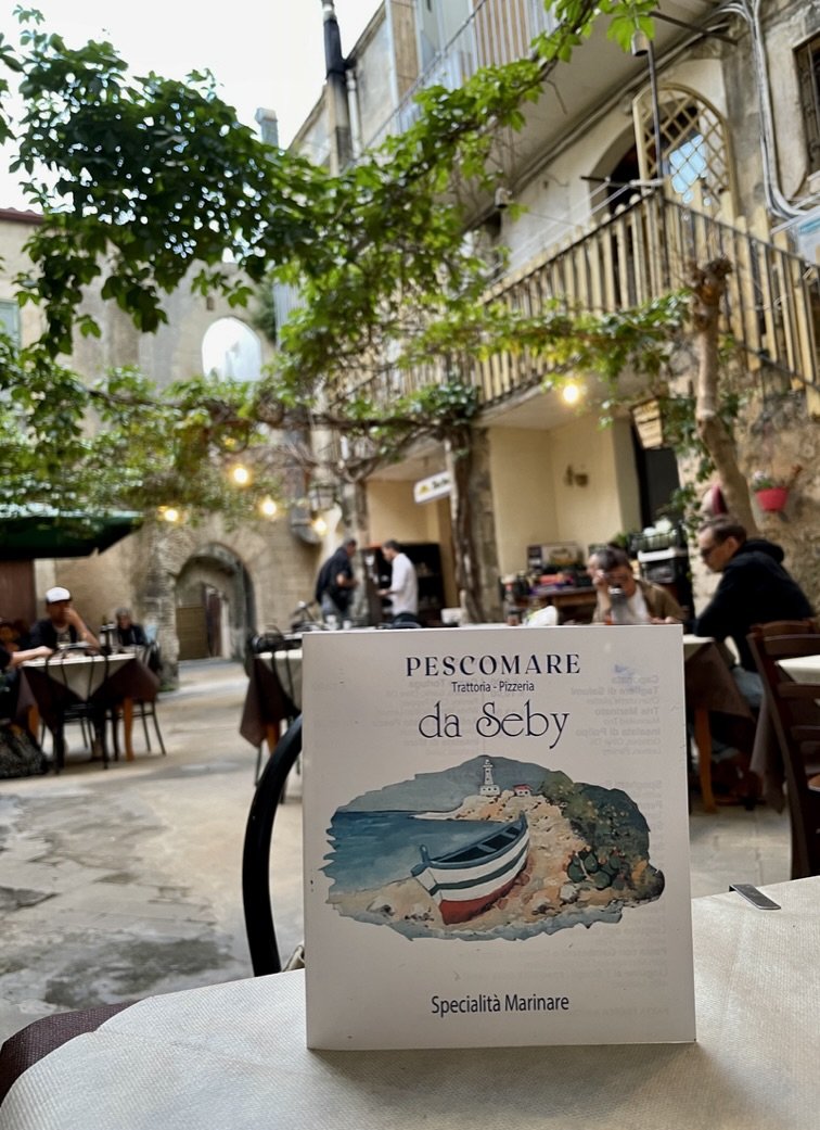  While we were meandering about Isola di Ortigia, we had walked by this restaurant.  It looked inviting &amp; the menu had items we wanted to try but it was too early.     