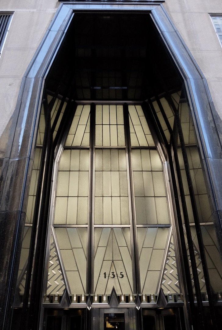 Chrysler Building entrance.  Nirosta steel doors, above which are etched-glass panels.