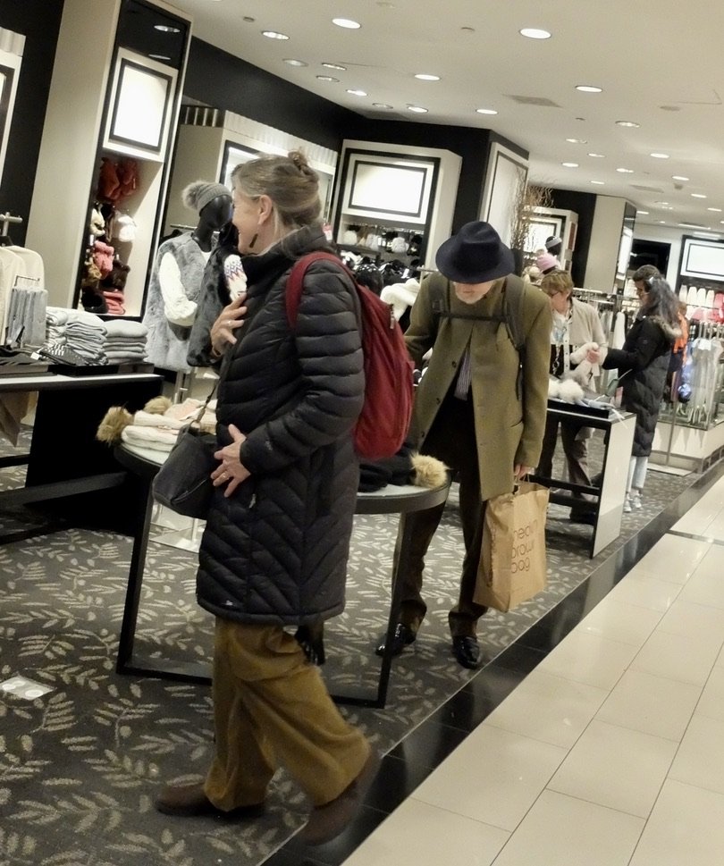  Bloomingdale's.    He’s carrying a well worn Bloomingdale's shopping bag. 