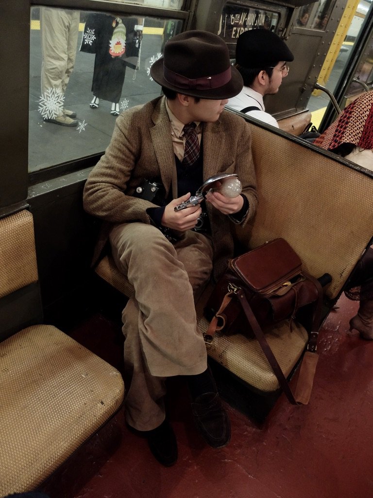  This fellow went all out in his dress &amp; was taking photos with his vintage flash bulb camera. 