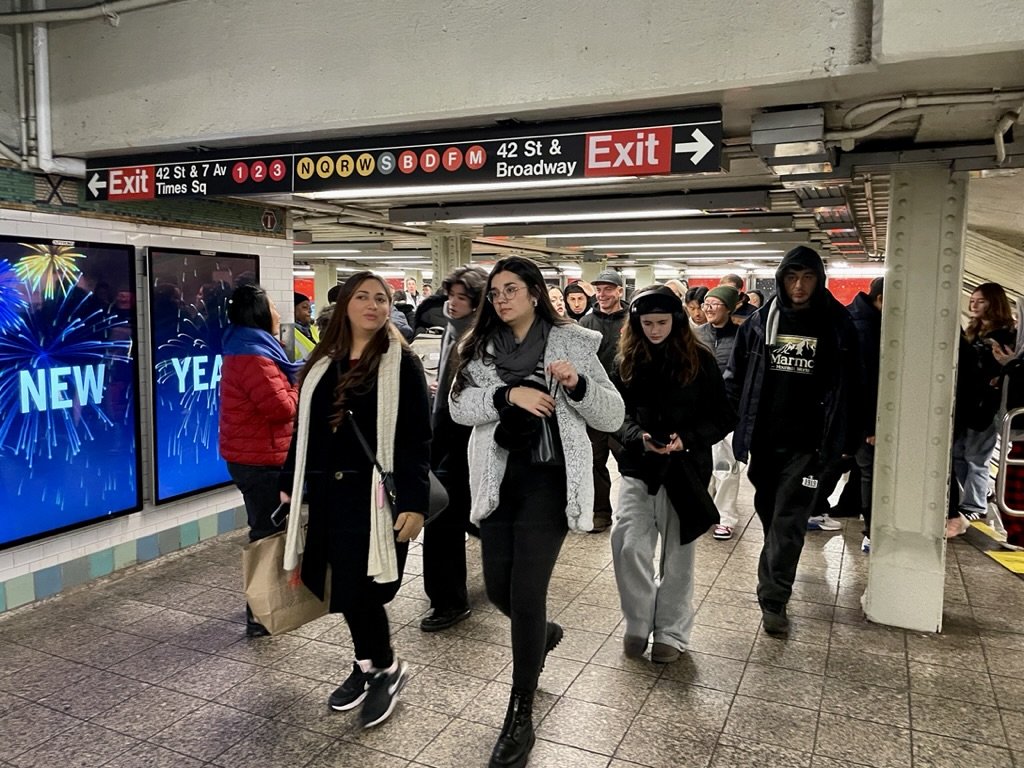  New Year's Eve in the Times Sq./42nd St. subway station. It was bedlam with all the exits blocked off but two.  We couldn’t escape &amp; just got on a train &amp; figured our way back to the Hotel Elysée. 