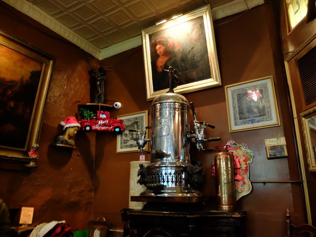  “Caffe Reggio is proud to be the first caffe in the United States to serve Cappuccino…Our splendid espresso machine, made in 1902, was the first of its kind.”  “…you will notice a beautiful array of artwork, some of which dates back to the Italian R