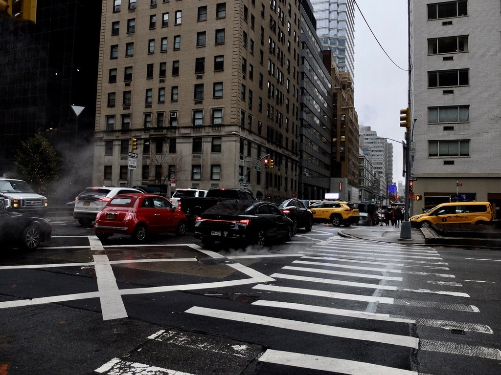  Those diagonal lines in the intersection denote that in this intersection pedestrians can participate in the "Barnes Dance" a.k.a. “a scramble..”  “…an intersection where car traffic halts for a bit so pedestrians can cross in all directions.  … nam