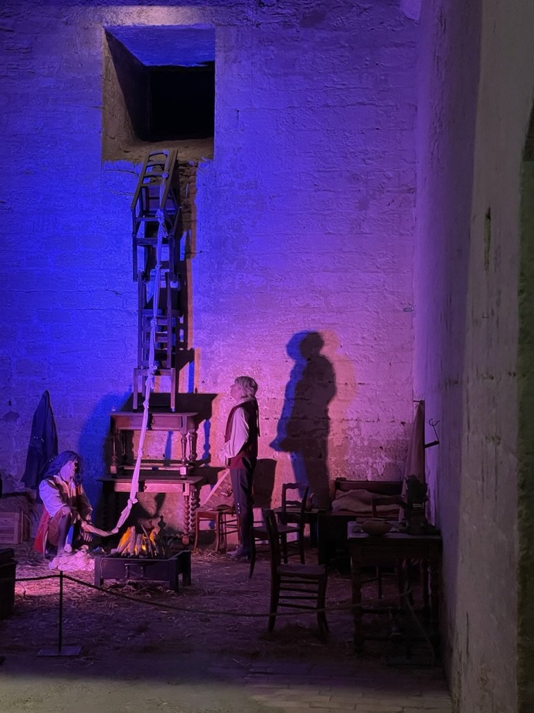  Recreation  of an escape attempt.from the tower.  The handmade rope was ten meters too short &amp; one prisoner fell to his death,  The others were recaptured.  