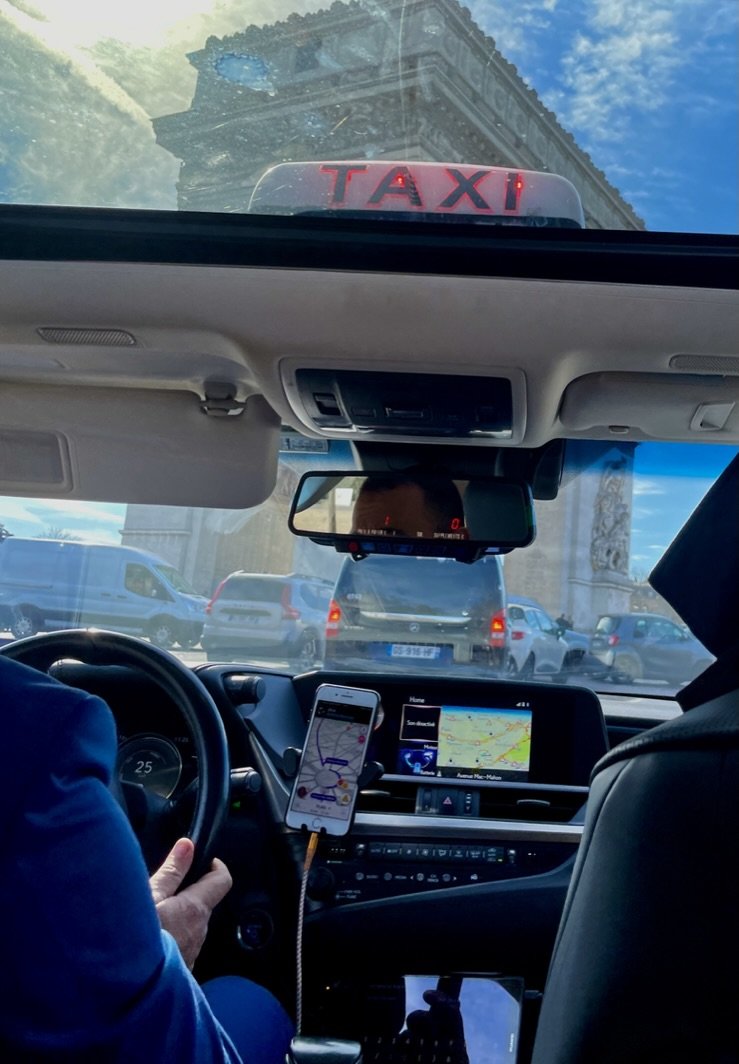 I loved our CDG airport to Paris hotel taxi ride with a sunroof.