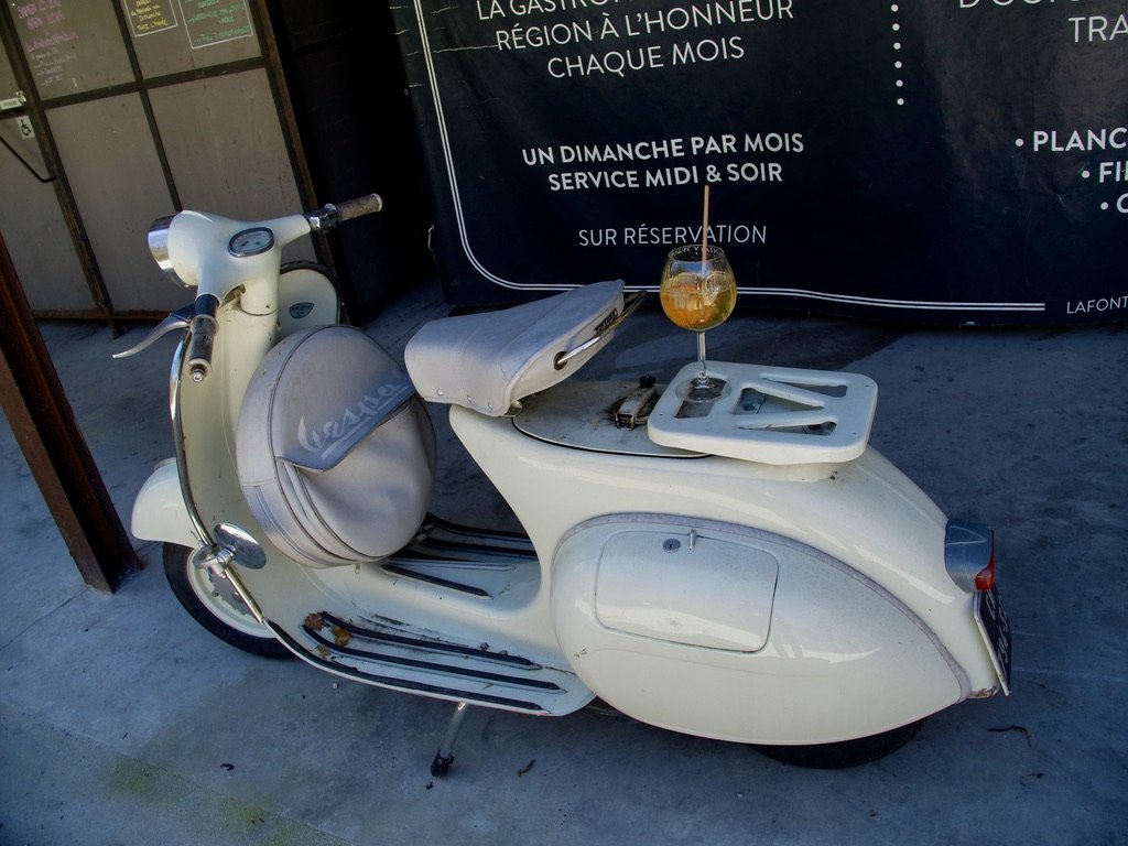  Not many scooters were seen on the roads of the Drôme.  This vintage one was in La Fontaine Minerale Cafe Restaruant.  That’s my drink. 