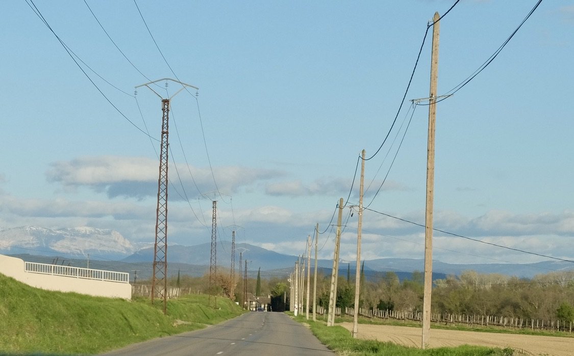On the right, power poles made of concrete.