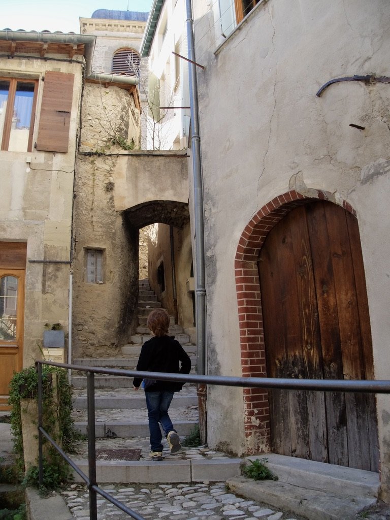 Walking up steps in town to the Tower of Crest.