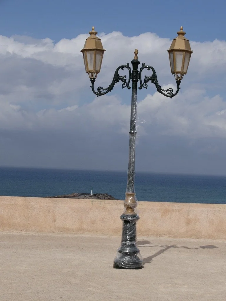 From viewpoint Oudayas a brand new lampost (recent Amazon delivery?) &amp; in the distance the c. 1920, still operating, Fort de la Calette Lighthouse.