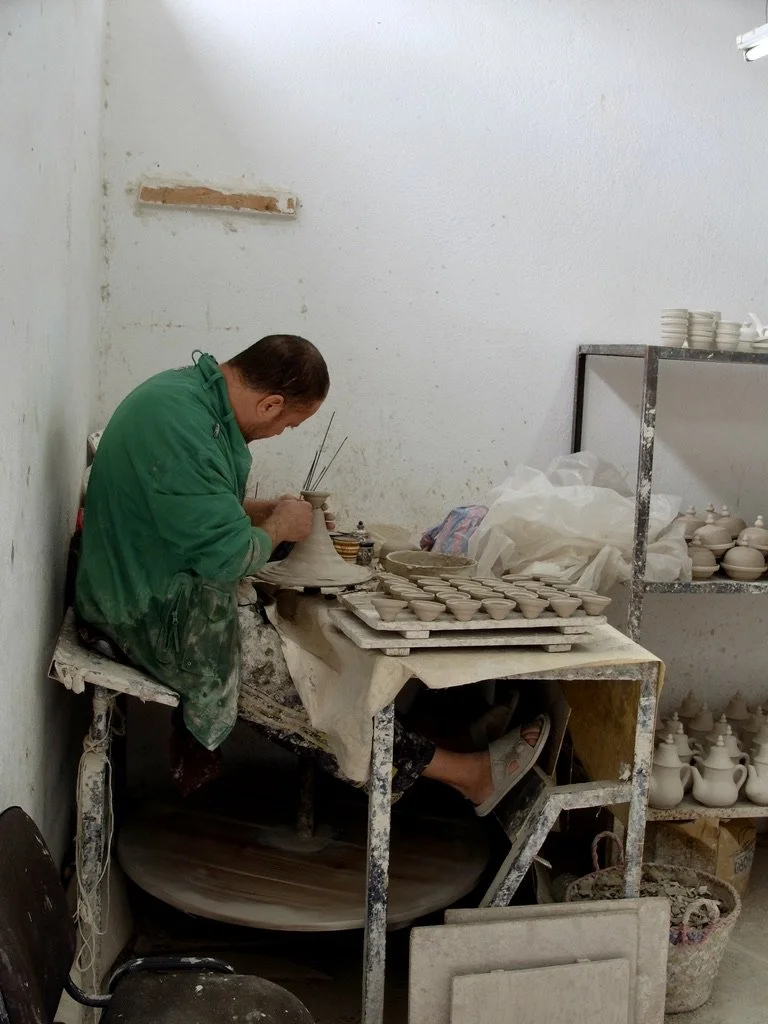  “Ain Nokbi, a district just outside the medina where potters were relocated in 2013 to spare their neighbours the dust and heat of the kilns.” 