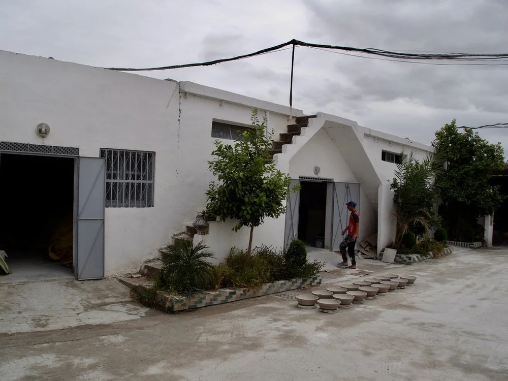  Ain Nokbi.  Ceramic bowls drying before any defects were corrected before a 2nd firing.  Note staircases sans bannisters. 
