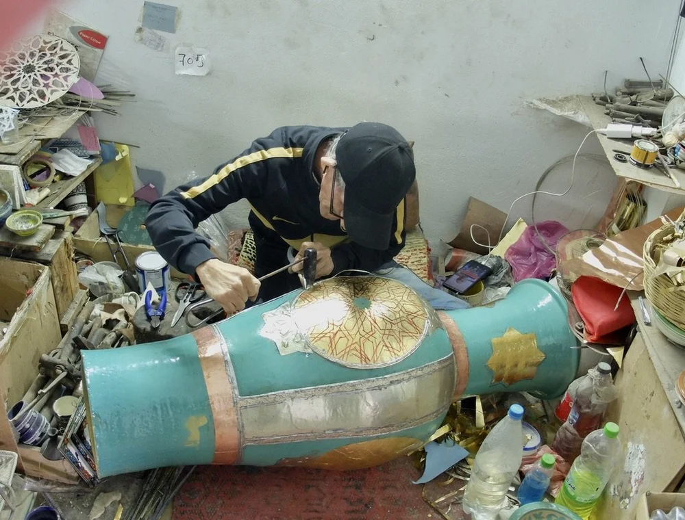  Ain Nokbi.  He’s working metal beading into the pottery.  Most of the workers were wearing ear buds. 