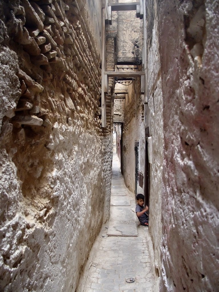 We saw kids playing soccer in these narrow alleys.