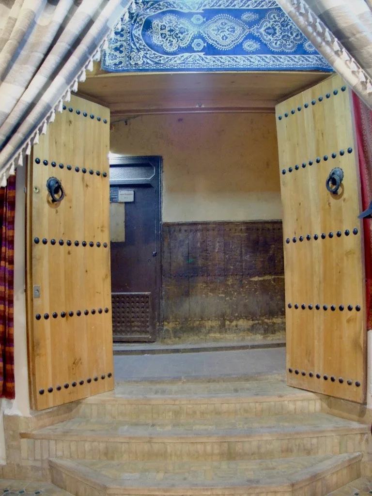 Note how the alley walkway is higher than the inside of this shop.  The city has gotten higher but the shop remains at the level from a looong time ago.