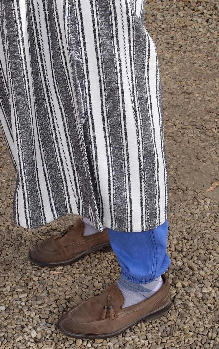  Gotta love the argyle socks (like I've been partial to) of this guide at the Site Archéologique de Volubilis.    Plus his djellaba...  