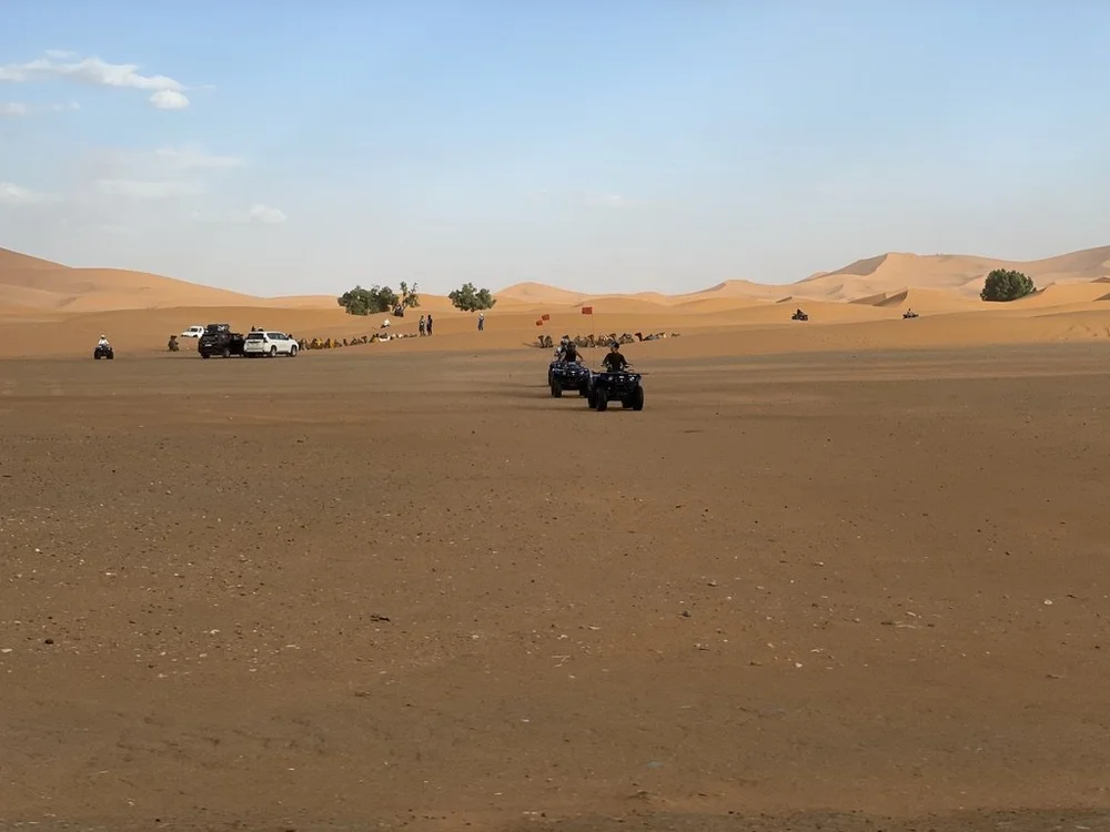Young guys on quads.  They were sons of some Arabian princes all dressed in white caftans &amp; were standing around.  I missed a photo op..  