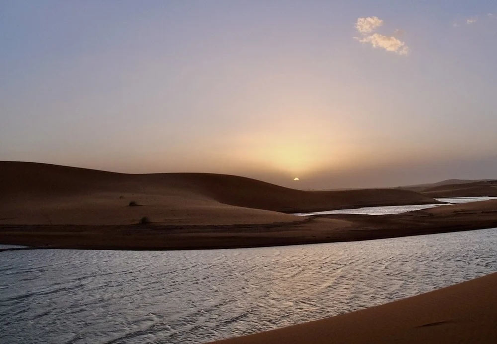 Recent deluge has left water in the desert that folks have not seen for years.   Under the sand is clay that keeps the water for a while.  We were told that locals were swimming in these mini lakes. 