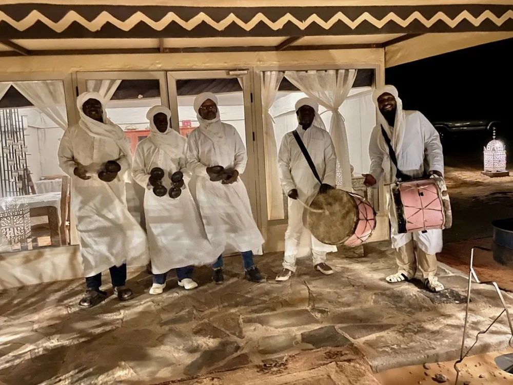  Men from the next village greeted us.  The music was great &amp; they had some really good dance moves. 